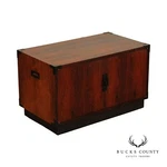 Mid Century Campaign Style Two-door Rosewood Cabinet. Fixed Price $965.00.