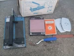 Vintage Tomechic Tile Cutter With Accessory. Fixed Price $39.00.